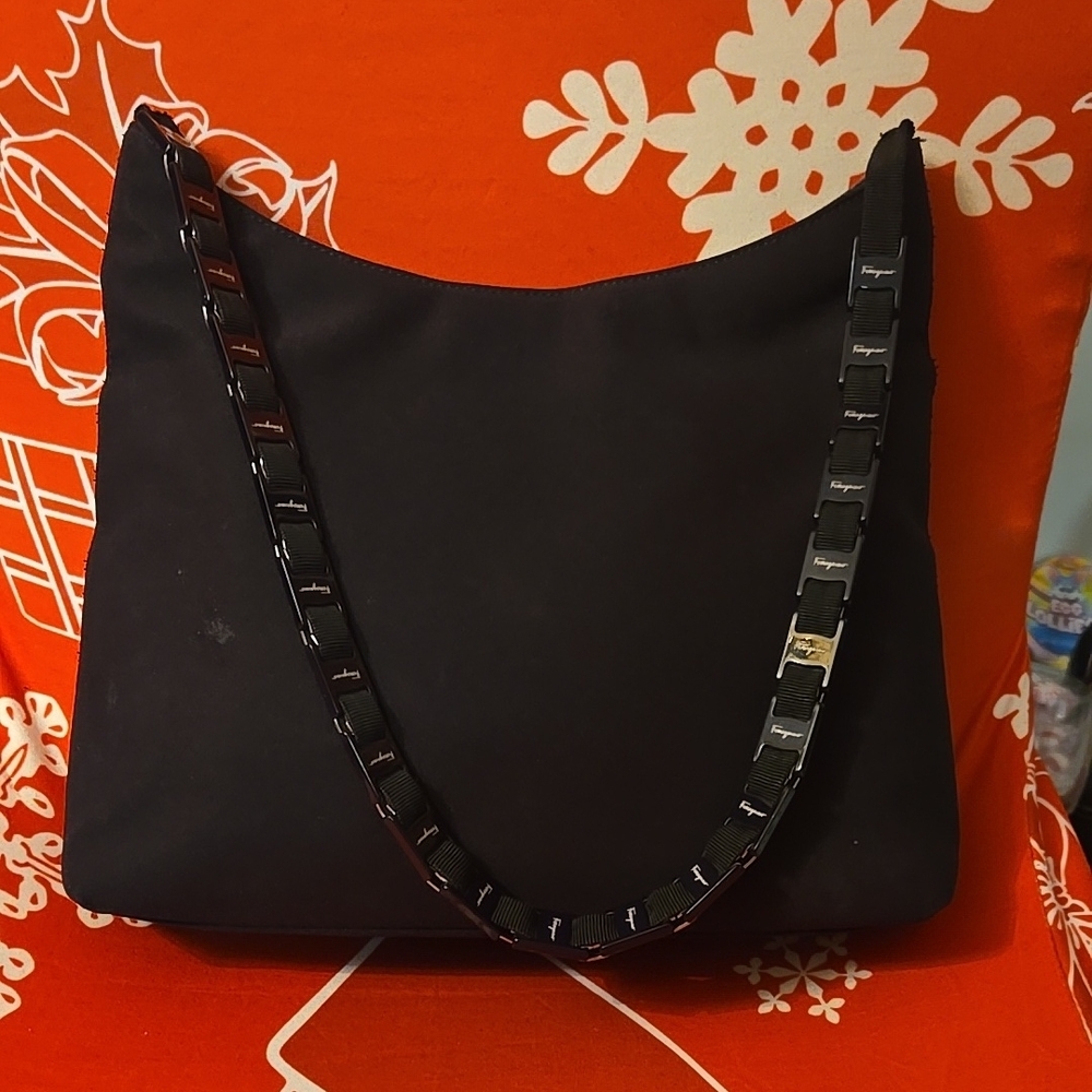 Black Shoulder Bag with Textured Fabric and Decorative Strap